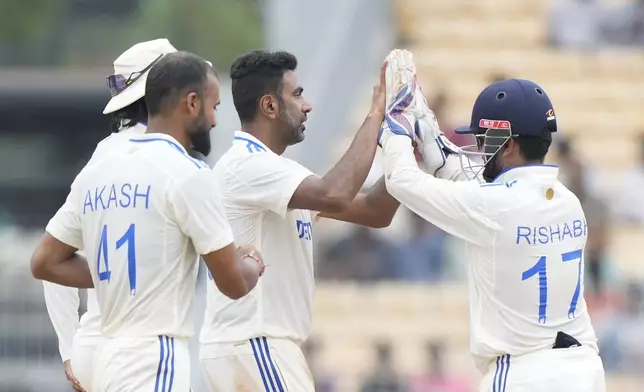 India's Ravichandran Ashwin, centre, celebrates with teammates the wicket of Bangladesh's Shakib Al Hasan on the fourth day of the first cricket test match between India and Bangladesh, in Chennai, India, Sunday, Sept. 22, 2024. (AP Photo/Mahesh Kumar A.)