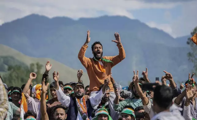 Supporters of India's opposition Congress party leader Rahul Gandhi, shout slogans during an election rally at Dooru, some 78 kilometers south of Srinagar, Indian controlled Kashmir, Sept. 4, 2024. (AP Photo/Mukhtar Khan, File)