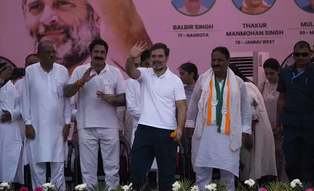 FILE- India's opposition Congress party leader Rahul Gandhi waves to supporters during a campaign rally of Jammu and Kashmir Assembly elections in Jammu, India, Sept.25, 2024.(AP Photo/Channi Anand, File)