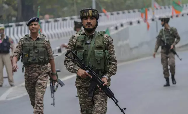 Indian paramilitary soldiers guard at a closed road ahead of Indian Prime Minister Narendra Modi's visit in Srinagar, Indian controlled Kashmir Thursday, Sept. 19, 2024. (AP Photo/Mukhtar Khan)