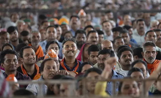 FILE- Bharatiya Janata Party (BJP) supporters listen as their Indian Prime Minister Narendra Modi speaks during a campaign rally of Jammu and Kashmir Assembly elections in Jammu, India, Saturday, Sept. 28, 2024. (AP Photo/Channi Anand, File)