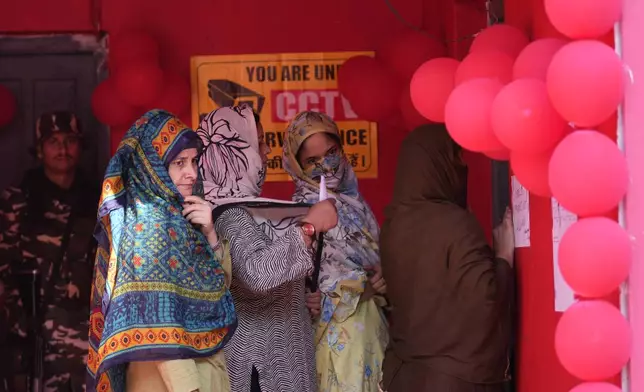 Women voters queue up to cast their vote at a polling booth during the first phase of the Jammu and Kashmir assembly election, in Kishtwar, India, Wednesday, Sept. 18, 2024. (AP Photo/Channi Anand)