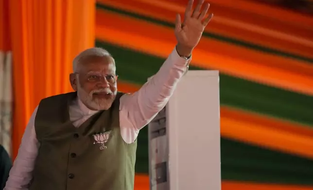 Indian Prime Minister Narendra Modi waves towards the crowd as he arrives to address the election rally in Srinagar, Indian controlled Kashmir, Thursday, Sept. 19, 2024. (AP Photo/Mukhtar Khan)