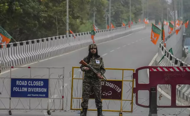 An Indian paramilitary soldier guards at a closed road ahead of Indian Prime Minister Narendra Modi's visit in Srinagar, Indian controlled Kashmir Thursday, Sept. 19, 2024. (AP Photo/Mukhtar Khan)