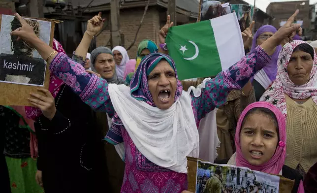 Kashmiris shout slogans during a protest after Friday prayers against the abrogation of article 370, on the outskirts of Srinagar, Indian controlled Kashmir, Friday, Oct. 4, 2019.(AP Photo/ Dar Yasin, File)