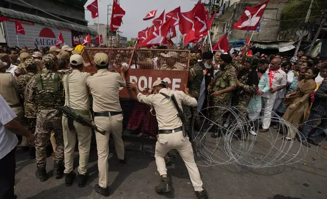 Policemen stop supporters of National Conference Party from accompanying their candidate during the filing of nomination papers for the upcoming Jammu and Kashmir Assembly elections in Jammu, India, Sept.10, 2024. (AP Photo/Channi Anand, File)