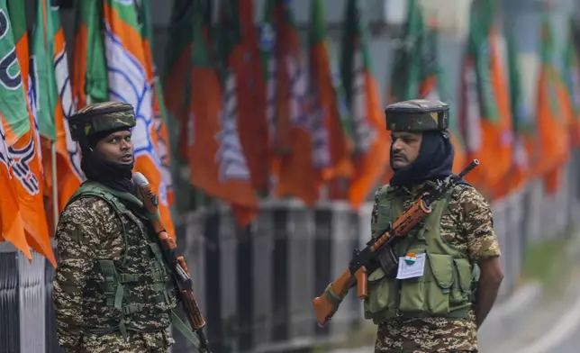 Indian paramilitary soldiers guard at a closed road ahead of Indian Prime Minister Narendra Modi's visit in Srinagar, Indian controlled Kashmir Thursday, Sept. 19, 2024. (AP Photo/Mukhtar Khan)