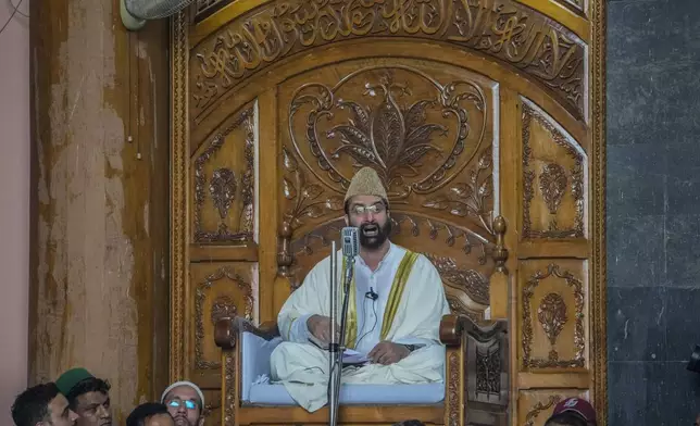 FILE- Top Kashmiri separatist leader Mirwaiz Umar Farooq delivers his speech inside the Jamia Masjid or Grand Mosque in Srinagar, Indian controlled Kashmir, Sept. 22, 2023. (AP Photo/Mukhtar Khan, File)