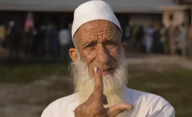 Abdul Ahad lone shows the indelible ink mark on his index finger after casting his vote in the outskirts of Srinagar, Indian controlled Kashmir, Wednesday, Sept. 25, 2024. (AP Photo/Dar Yasin)