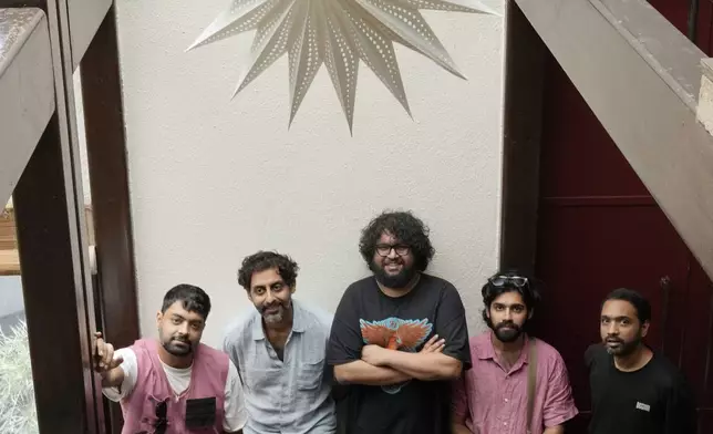 From left, Karan Singh, Suryakant Sawhney, Kartik Pillai,Dhruv Bhola, and Rohit Gupta from Peter Cat Recording Co pose for a photograph in Mumbai, India, Friday, Aug. 2, 2024. (AP Photo/Rajanish Kakade)