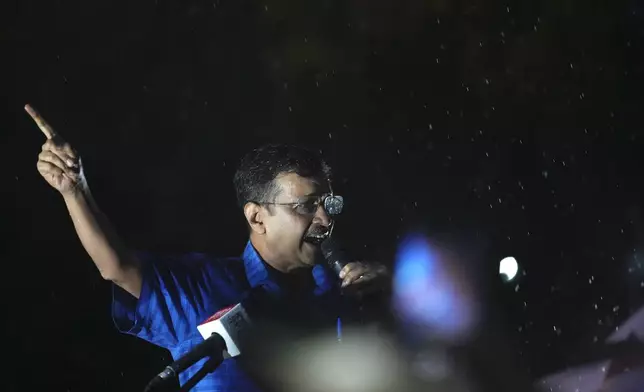 Aam Aadmi Party leader and Chief Minister of Delhi, Arvind Kejriwal, speaks to his followers in the rain as he comes out of Tihar prison after being granted bail by the country's highest court, in New Delhi, India, Friday, Sept. 13, 2024. (AP Photo/Manish Swarup)