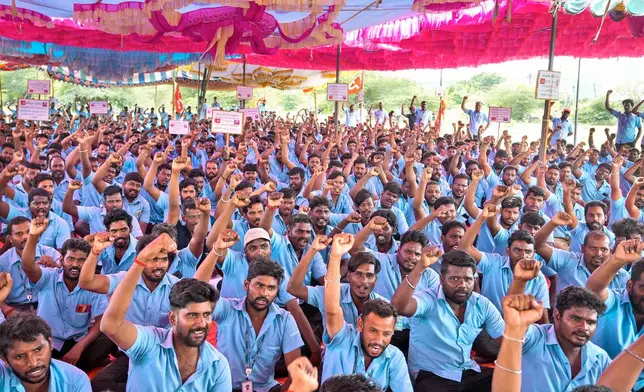 Samsung workers who are on strike shout slogans during a protest near their plant in Sriperumbudur, on the outskirts of Chennai, India, Tuesday, Sept. 24, 2024. (AP Photo/Mahesh Kumar A.)