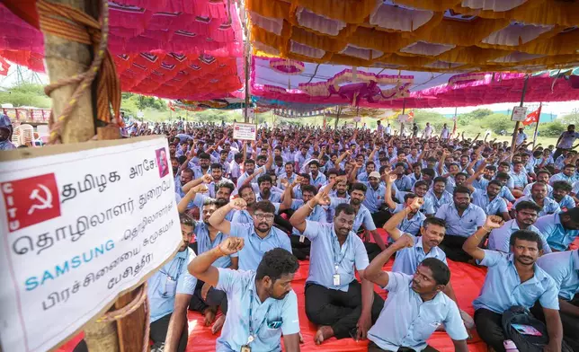 Samsung workers who are on strike shout slogans during a protest near their plant in Sriperumbudur, on the outskirts of Chennai, India, Tuesday, Sept. 24, 2024. (AP Photo/Mahesh Kumar A.)