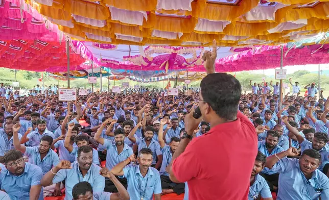 Samsung workers who are on strike shout slogans during a protest near their plant in Sriperumbudur, on the outskirts of Chennai, India, Tuesday, Sept. 24, 2024. (AP Photo/Mahesh Kumar A.)