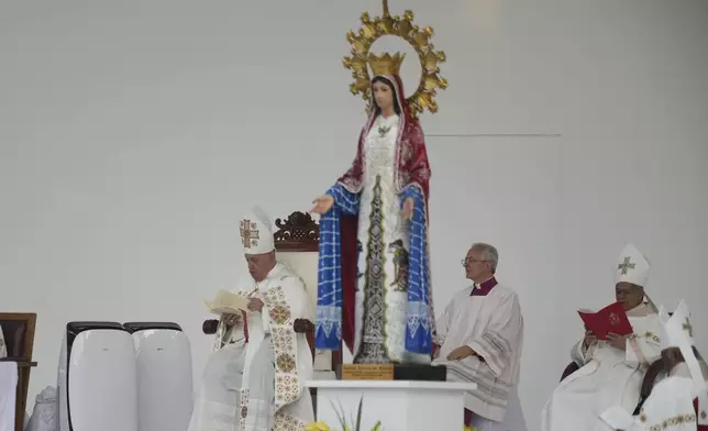 Pope Francis, left, leads the holy mass at Gelora Bung Karno Stadium in Jakarta, Indonesia, Thursday, Sept. 5, 2024. (AP Photo/Achmad Ibrahim, Pool)