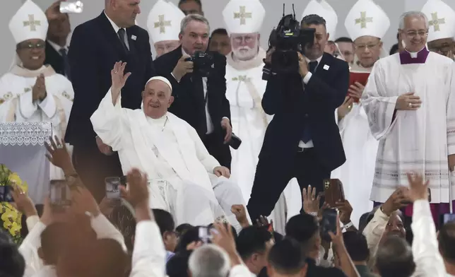 Pope Francis prepares to depart after leading a Holy Mass at Gelora Bung Karno Stadium, in Jakarta, Thursday, Sept. 5, 2024. (Adi Weda/Pool Photo via AP)