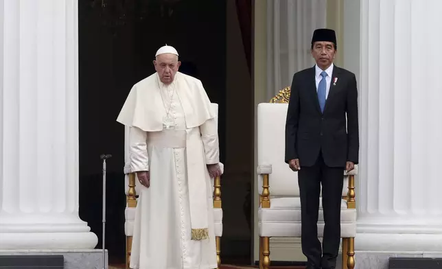 Pope Francis, left, and Indonesian President Joko Widodo attend a welcome ceremony at the Istana Merdeka Presidential Palace in Jakarta Wednesday, Sept. 4, 2024. (Adi Weda/Pool Photo via AP)