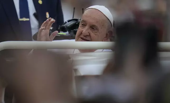 Pope Francis arrives to lead the holy mass at Gelora Bung Karno Stadium in Jakarta, Indonesia, Thursday, Sept. 5, 2024. (AP Photo/Achmad Ibrahim, Pool)