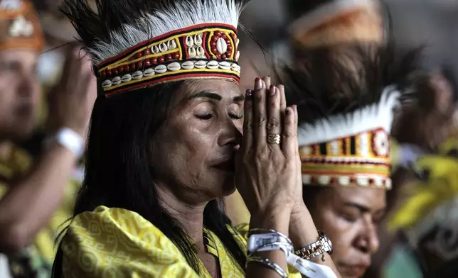 Catholic faithful attend a holy mass led by Pope Francis at the Gelora Bung Karno Stadium, in Jakarta, Thursday, Sept. 5, 2024. (Yasuyoshi Chiba/Pool Photo via AP)