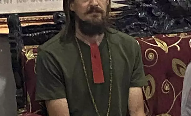 In this photo released by Cartenz Peace Task Force (Satgas Damai Cartenz) of the Indonesian security forces, New Zealand pilot Phillip Mehrtens, who was held hostage for more than a year in the restive Papua region, sits after his release, in Timika, Papua province, Saturday, Sept. 21, 2024. (Satgas Damai Cartenz via AP)