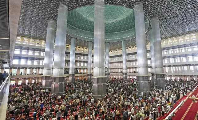 Muslim men attend Friday prayer at Istiqlal Mosque in Jakarta, Indonesia, Friday, Aug. 9, 2024, where Pope Francis is scheduled to hold an interfaith meeting on Sept. 5. (AP Photo/Tatan Syuflana)