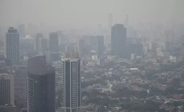 FILE- Haze blankets the main business district in Jakarta, Indonesia, on Aug. 11, 2023. (AP Photo/Dita Alangkara, File)