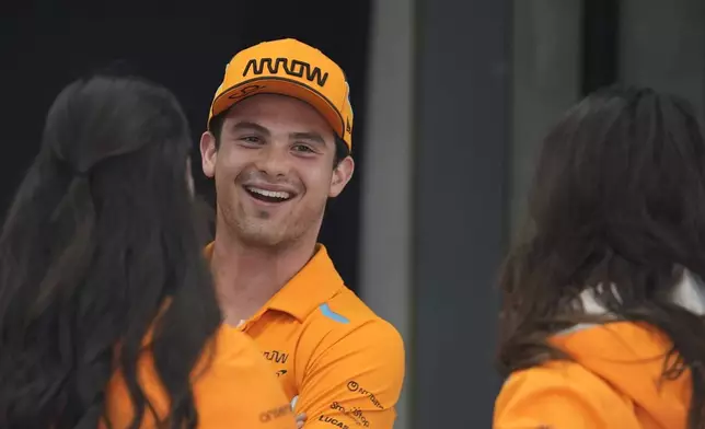 FILE - Pato O'Ward, of Mexico, talks with staff members before the Indianapolis 500 auto race at Indianapolis Motor Speedway, Sunday, May 26, 2024, in Indianapolis. (AP Photo/Darron Cummings, File)