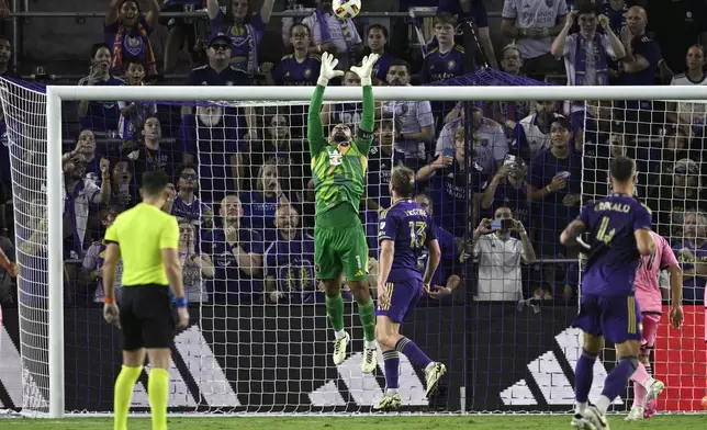 FILE - Inter Miami goalkeeper Drake Callender (1) makes a save during the second half of an MLS soccer match against Orlando City, May 15, 2024, in Orlando, Fla. (AP Photo/Phelan M. Ebenhack, File)