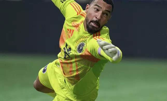 FILE - The ball bounces off the post behind Inter Miami goalkeeper Drake Callender and stays out of the net on a Vancouver Whitecaps shot during the second half of an MLS soccer match May 25, 2024, in Vancouver, British Columbia. (Darryl Dyck/The Canadian Press via AP, File)