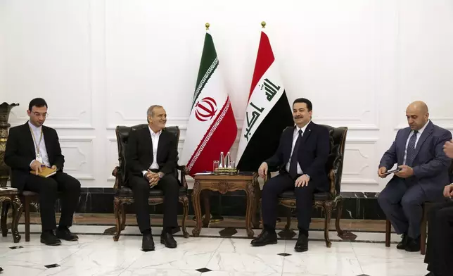 Iranian President Masoud Pezeshkian, center left, and Iraqi Prime Minister Mohammed Shia al-Sudani, center right, meet at the government palace in Baghdad, Iraq, Wednesday, Sept. 11, 2024. (Ahmed Jalil/Pool Photo via AP)