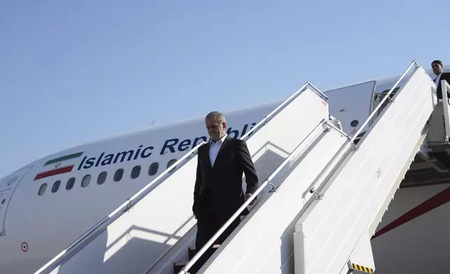 Iranian President Masoud Pezeshkian arrives at the Baghdad International Airport in Baghdad, Iraq, Wednesday Sept. 11, 2024. (Murtadha Al-Sudani/Pool Photo via AP)