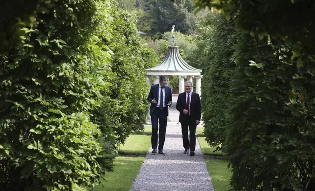 The Prime Minister of Ireland Simon Harris, left listens to his British counterpart Keir Starmer as they meet for talks at Farmleigh House in Dublin, Ireland, Saturday, Sept. 7, 2024. (AP Photo/Peter Morrison Pool)