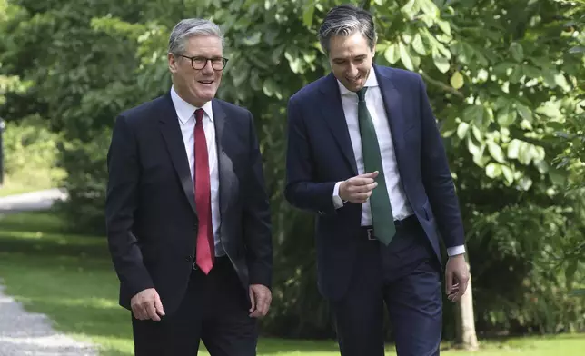 The Prime Minister of Ireland Simon Harris, right speaks with his British counterpart Keir Starmer as they meet for talks at Farmleigh House in Dublin, Ireland, Saturday, Sept. 7, 2024. (AP Photo/Peter Morrison Pool)