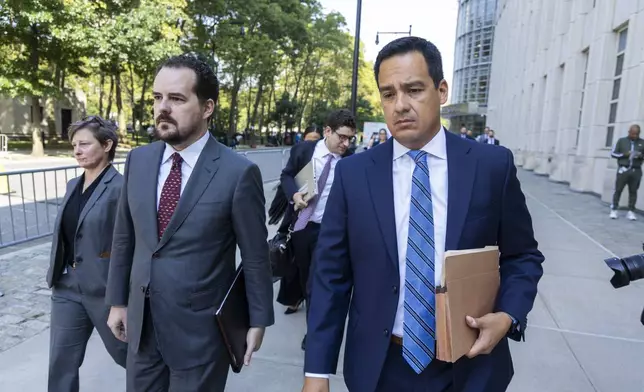 Assistant U.S. Attorney Francisco Navarro, right, leaves Brooklyn Federal court after the arraignment of longtime drug cartel leader Ismael “El Mayo” Zambada, Friday, Sept. 13, 2024, in New York. (AP Photo/Corey Sipkin)