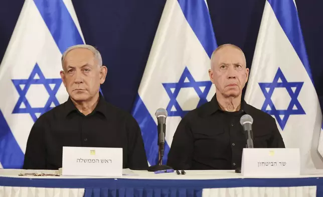 FILE -Israeli Prime Minister Benjamin Netanyahu, left and Defense Minister Yoav Gallant attend a press conference in the Kirya military base in Tel Aviv, Israel, Oct. 28, 2023. (Abir Sultan/Pool Photo via AP, File)