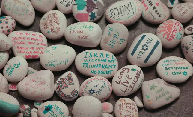 Decorated stones are seen during a vigil Sunday, Sept. 1, 2024, in Culver City, Calif., for the six hostages who were found dead in Rafah, southern Gaza. (AP Photo/Ryan Sun)