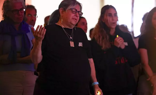 Mourners gather during a vigil Sunday, Sept. 1, 2024, in Culver City, Calif., for the six hostages who were found dead in Rafah, southern Gaza. (AP Photo/Ryan Sun)