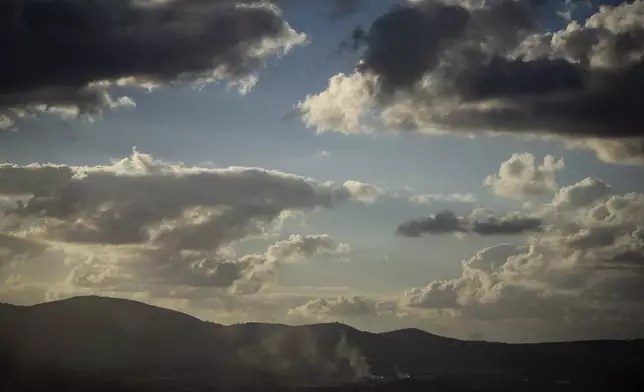 Smoke rises after an Israeli shelling on an area in Lebanon, seen from the Israel-annexed Golan Heights, next to the Israeli-Lebanese border, Monday, Sept. 16, 2024. (AP Photo/Leo Correa)