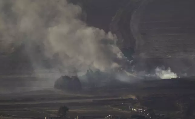 Smoke rises after an Israeli shelling on an area in Lebanon, seen from the Israel-annexed Golan Heights, next to the Israeli-Lebanese border, Monday, Sept. 16, 2024. (AP Photo/Leo Correa)