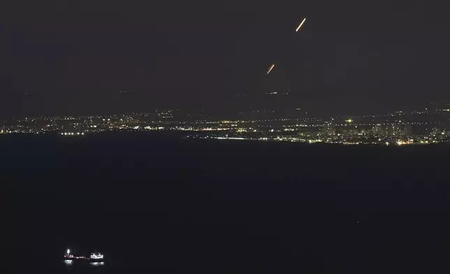 Israeli Iron Dome air defense system fires to intercept rockets that were launched from Lebanon, as seen from Haifa, northern Israel, Thursday, Sept. 26, 2024. (AP Photo/Baz Ratner)