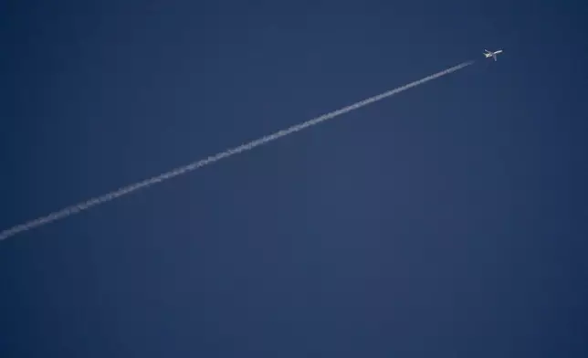 An Israeli surveillance aircraft seen from Hadera flies over the Mediterranean sea towards northern Israel, on Tuesday, Sept. 24, 2024. (AP Photo/Ariel Schalit)