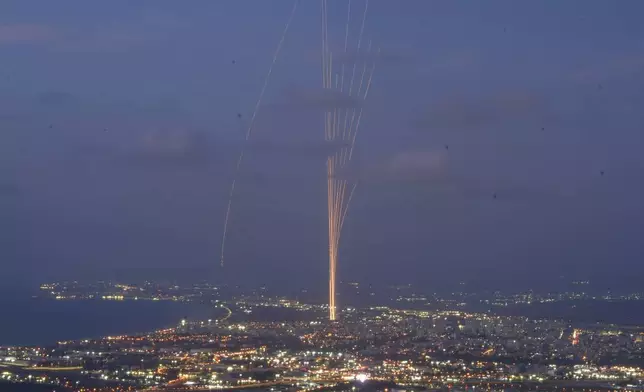 Israeli Iron Dome air defense system fires to intercept rockets that were launched from Lebanon, as seen from Haifa, northern Israel, Monday, Sept. 23, 2024. (AP Photo/Baz Ratner)