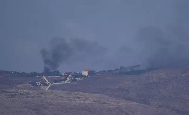 Smoke rises following an Israeli airstrike in southern Lebanon as seen from northern Israel on Sunday, Sept. 29, 2024. (AP Photo/Ariel Schalit)