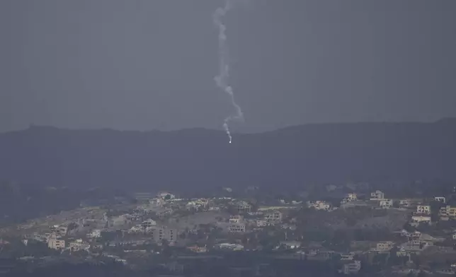 An Israeli army flare is seen over the Israeli-Lebanese border as seen from the Israeli-annexed Golan Heights, Monday, Sept. 16, 2024. (AP Photo/Leo Correa)