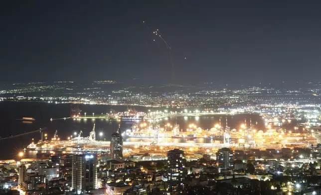 Israeli Iron Dome air defense system fires to intercept rockets that were launched from Lebanon, in northern Israel, Tuesday, Sept. 24, 2024. (AP Photo/Ohad Zwigenberg)