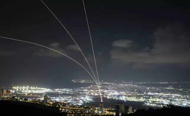 Israeli Iron Dome air defense system fires to intercept rockets that were launched from Lebanon, as seen from Haifa, northern Israel, Monday, Sept. 23, 2024. (AP Photo/Baz Ratner)