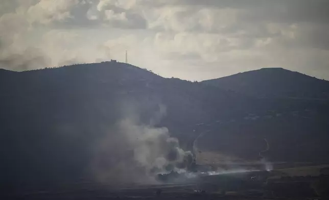 Smoke rises after an Israeli shelling on an area in Lebanon, seen from the Israel-annexed Golan Heights, next to the Israeli-Lebanese border, Monday, Sept. 16, 2024. (AP Photo/Leo Correa)