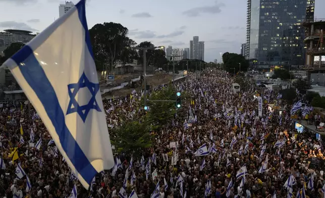 People take part in a protest calling for a deal for immediate release of hostages held in the Gaza Strip by the Hamas militant group, in Tel Aviv, Sunday, Sept. 1, 2024. (AP Photo/Ariel Schalit)