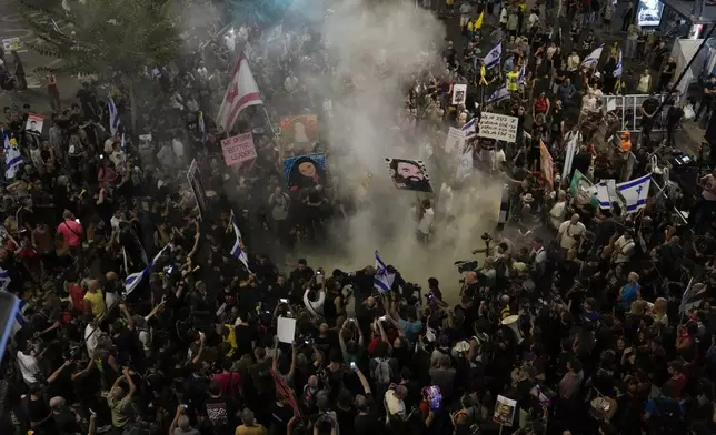 People protest against Prime Minister Benjamin Netanyahu's government and call for the release of hostages held in the Gaza Strip by the Hamas militant group, in Tel Aviv, Israel, Saturday, Sept. 21, 2024. (AP Photo/Mahmoud Illean)