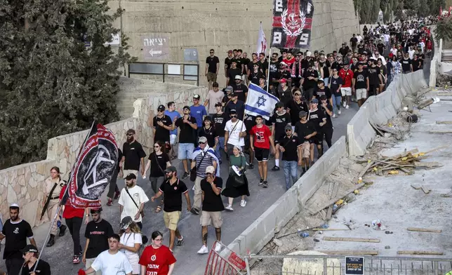 Mourners attend the funeral of Israeli-American hostage Hersh Goldberg-Polin, who was killed in Hamas captivity in the Gaza Strip, in Jerusalem, Monday, Sept. 2, 2024. (Gil Cohen-Magen/Pool via AP)